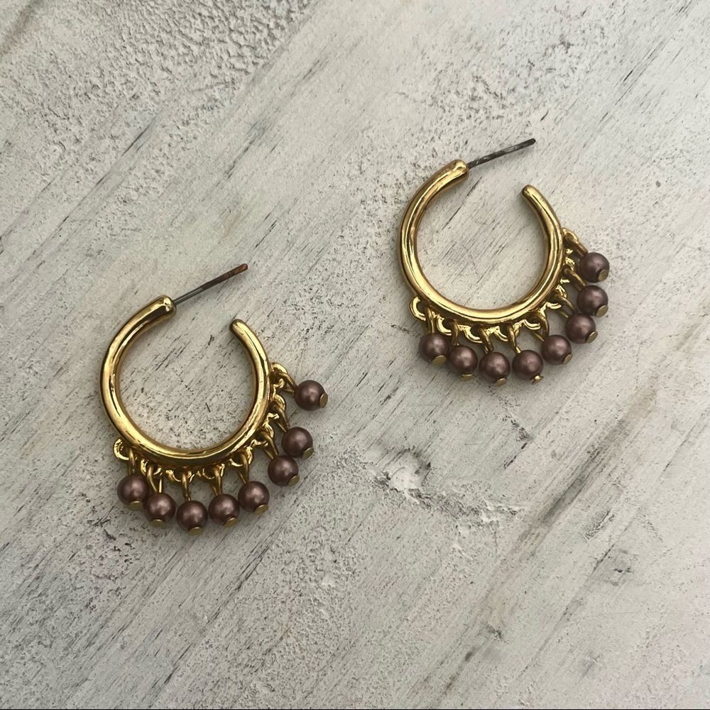 Gold tone hoop earrings with purple beads
